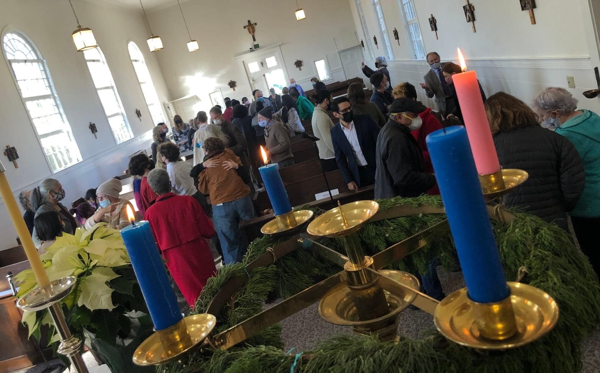 Members of L.A.'s Holy Nativity Episcopal Church, Westchester, pass the peace on the third Sunday of Advent, the day before this message was sent to the diocesan community. Photo: Bishop Taylor